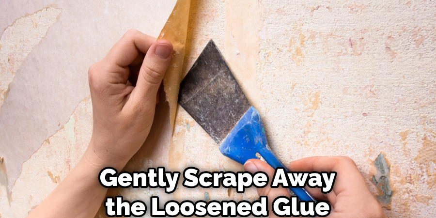 Gently Scrape Away the Loosened Glue