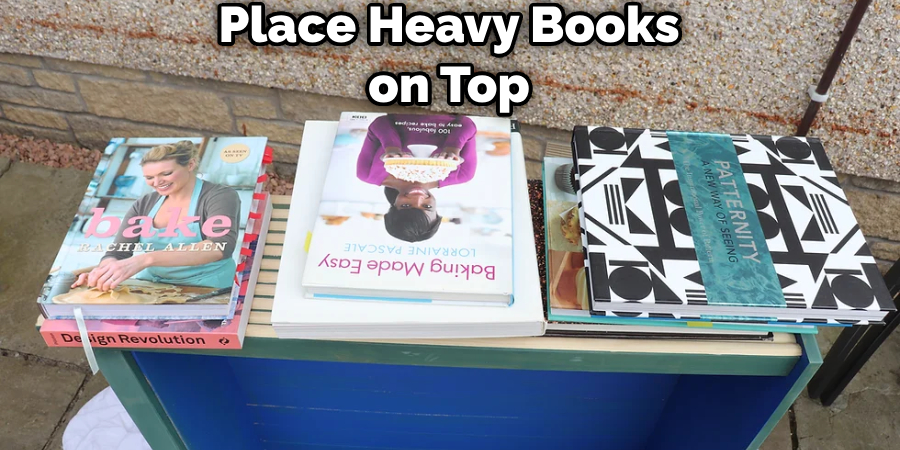 Place Heavy Books on Top